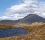 scotland highlands mountain walking rainbow